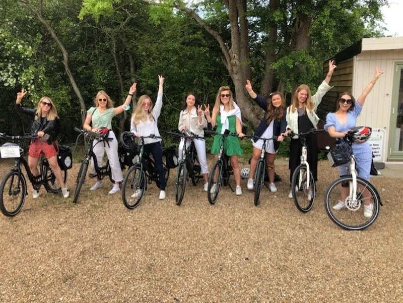 Couple enjoying an e-bike ride through a vineyard in Kent