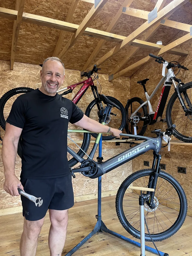 Mechanic working on an electric bike in a workshop